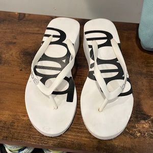 Bebe slides. One heels and one flat.